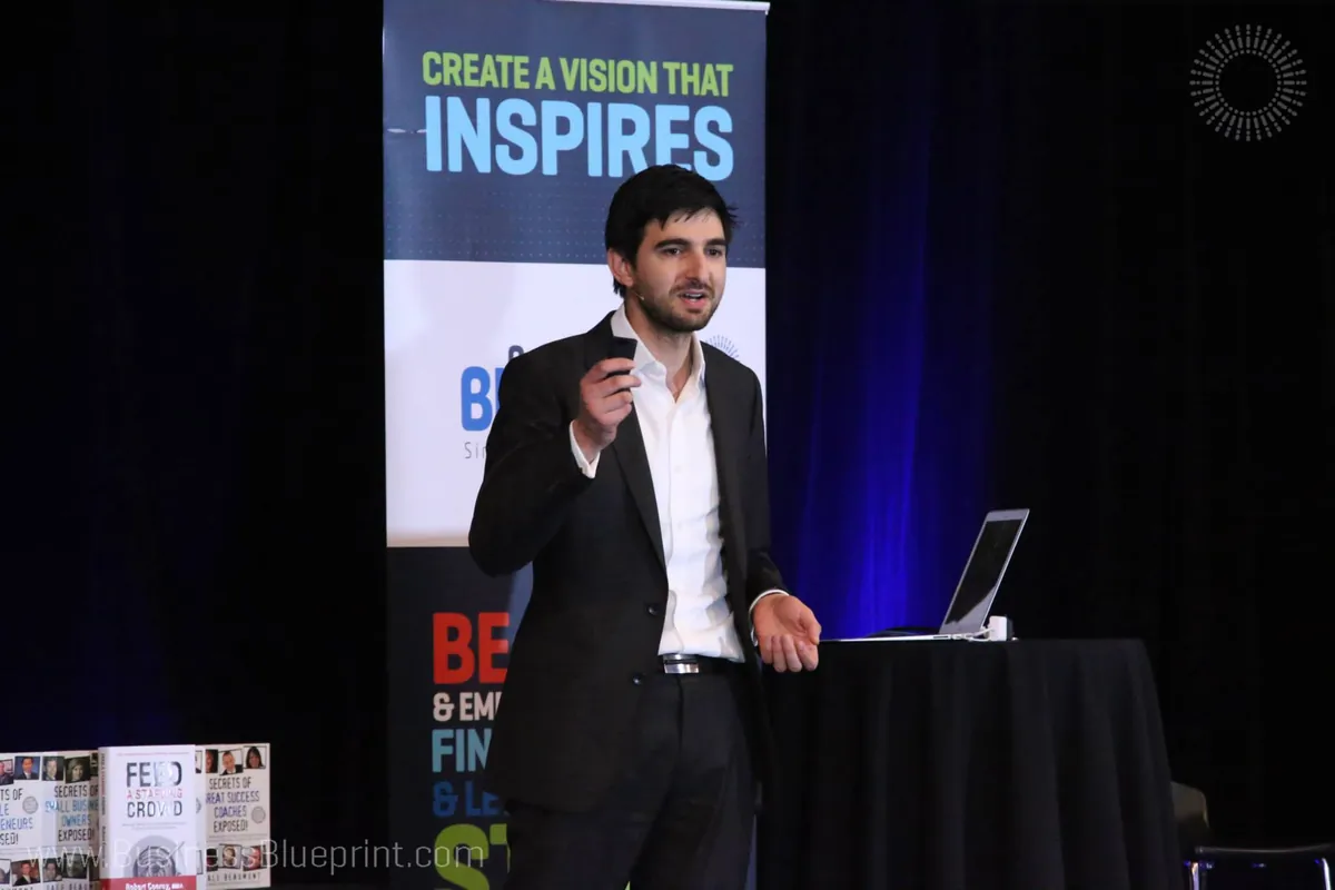 Robert Coorey speaking on stage